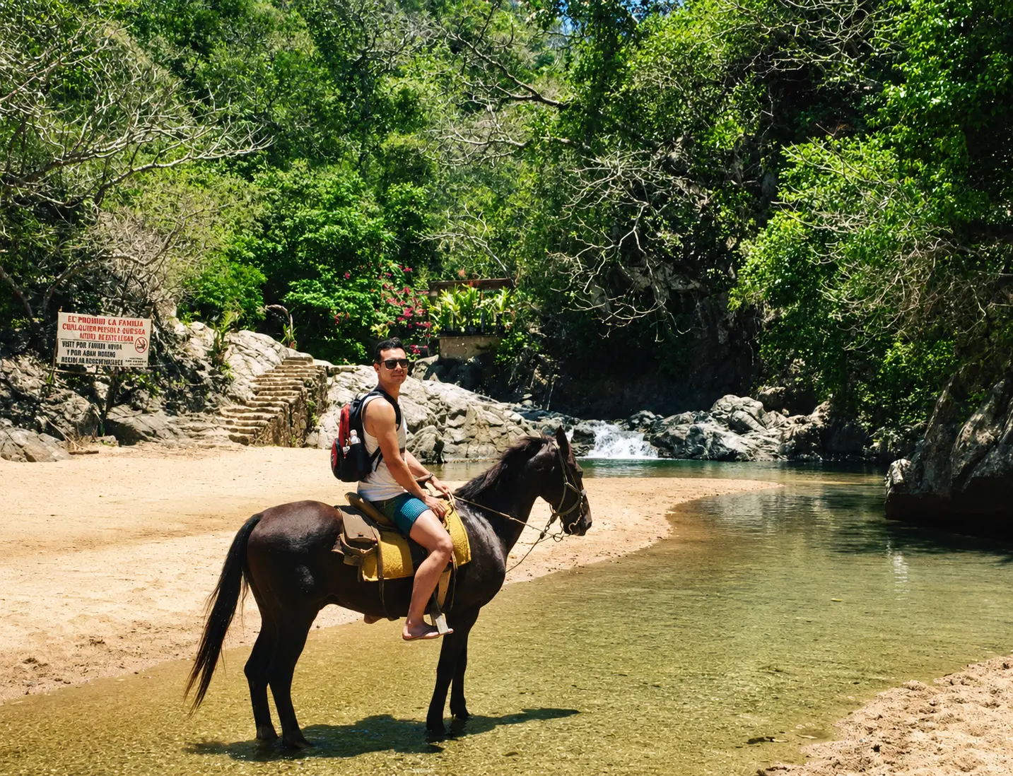 Horseback ride along the Quimixto river toward the waterfall